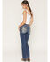 Image #1 - Miss Me Women's Medium Wash Mid Rise Fleur De Lis Pocket 32" Bootcut Stretch Denim Jeans, Medium Wash, hi-res