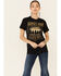 Image #1 - Kerusso Women's Heroes Ride Off Into The West Graphic Short Sleeve Tee, Black, hi-res