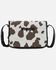 Image #1 - Wrangler Women's Cow Print Crossbody Bag, Black, hi-res