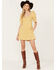 Image #1 - Free People Women's Cheyenne Denim Mini Dress, Yellow, hi-res