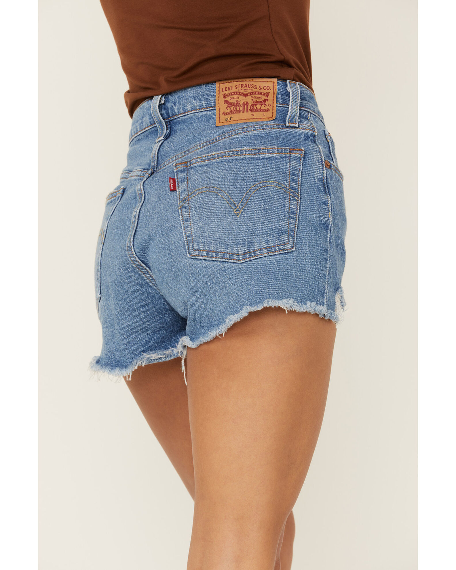501 high rise medium wash distressed denim cutoff shorts hot sale