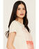 Image #2 - White Crow Women's Saddle Up Buttercup Short Sleeve Graphic Tee, Tan, hi-res