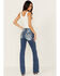 Image #1 - Miss Me Women's Medium Wash Mid Rise Border Flap Pocket Bootcut Stretch Denim Jeans, Medium Wash, hi-res