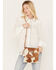 Image #1 - Idyllwind Women's Canyon Ridge Hair-On Cowhide Crossbody Bag, Lt Brown, hi-res