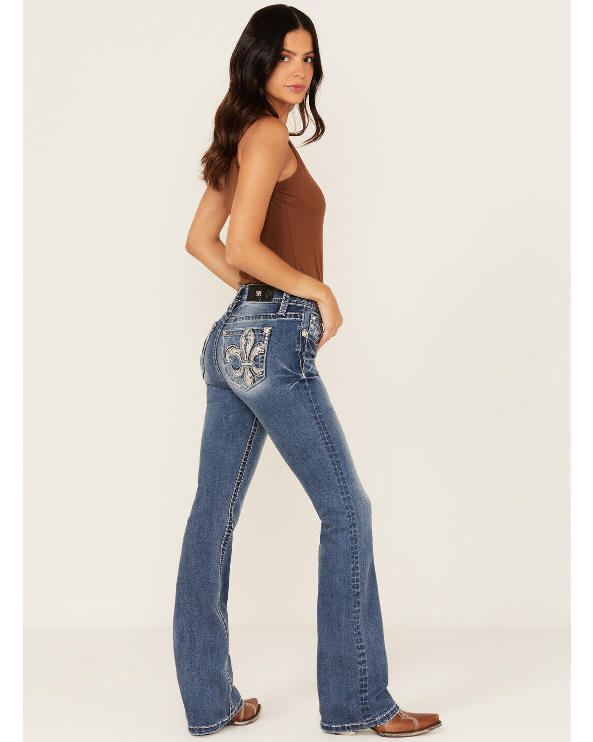 Image #1 - Miss Me Women's Medium Wash Mid Rise Fleur de Lis Pocket 32" Bootcut Stretch Denim Jeans, Medium Wash, hi-res