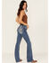 Image #1 - Miss Me Women's Medium Wash Mid Rise Fleur de Lis Pocket 32" Bootcut Stretch Denim Jeans, Medium Wash, hi-res